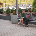 GPC employees enjoy a chat in the headquarter building's outdoor plaza.