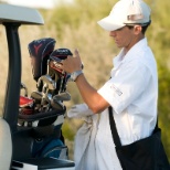 Caddie assisting golfers on the course