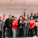 Employees celebrating with leadership