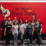 Employees volunteering at St. Mary's Food Bank